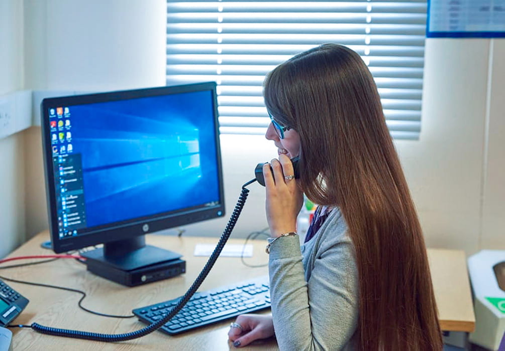 Female office worker making a phone call