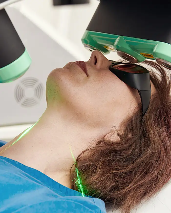 brand photography of woman receiving skin treatment