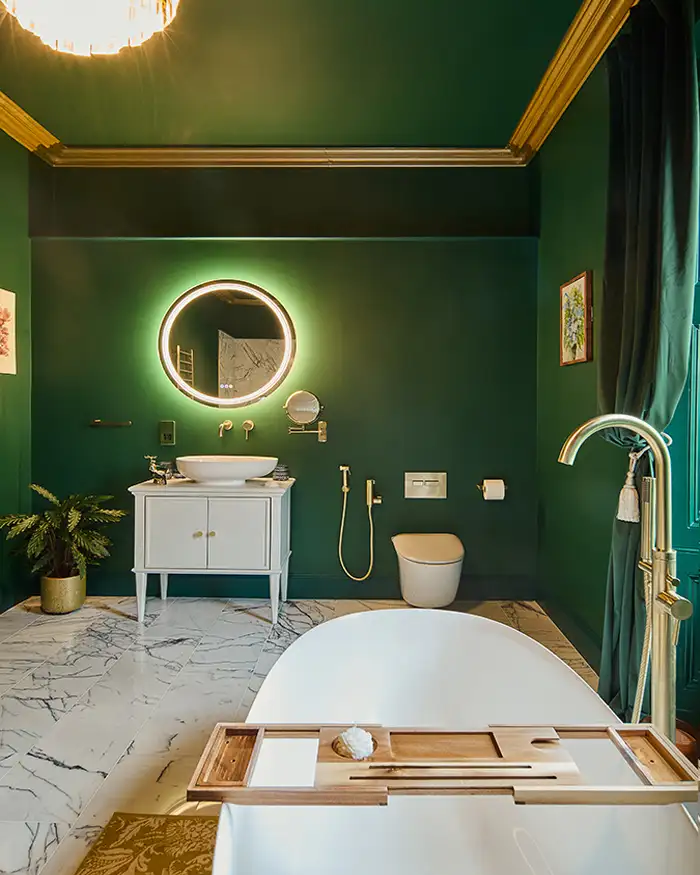 luxurious bathroom with green walls